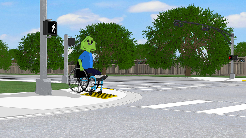 A child using a wheelchair, using a curb ramp