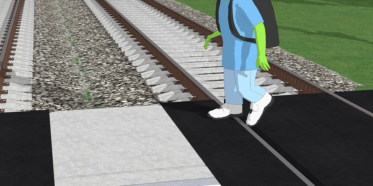 A closeup of how a shoe can get stuck in the gap between the road and the rails